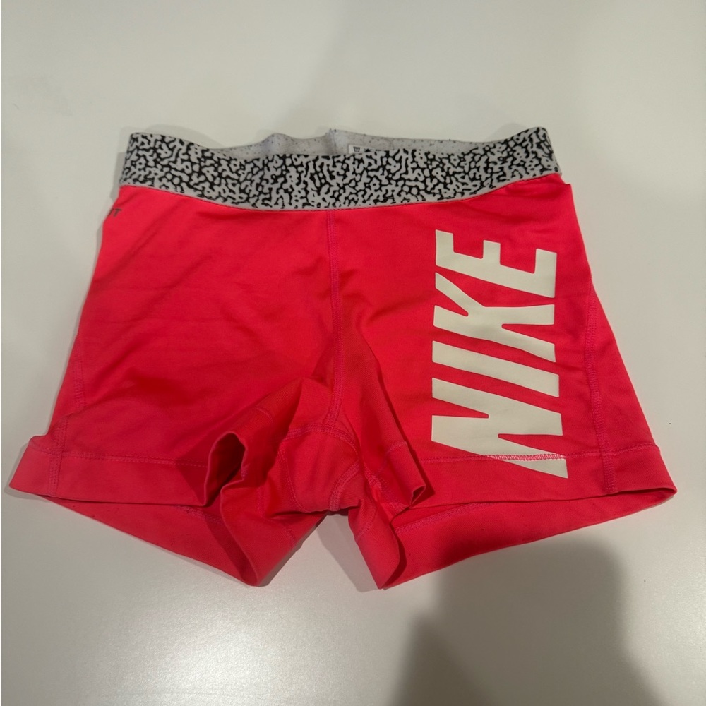 Neon coral Nike pros